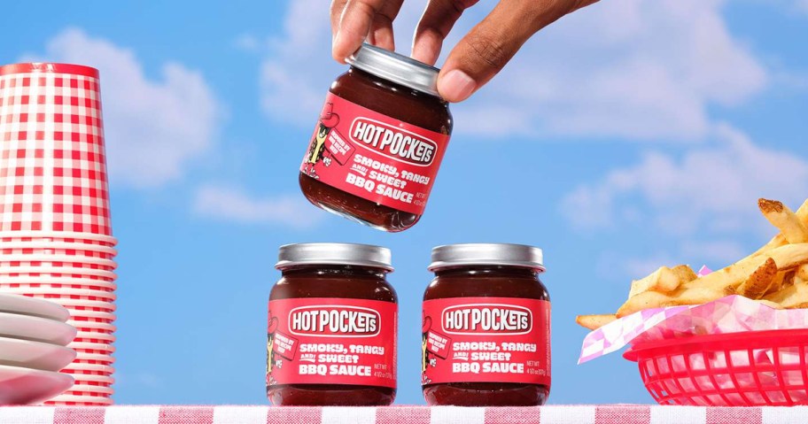 hand reaching for hot pocket bbq sauce jar