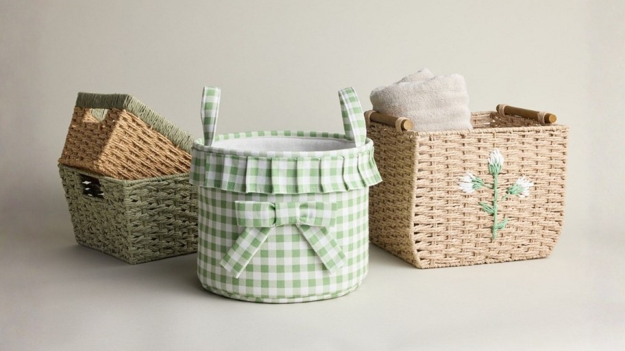 four storage baskets in different sizes, shapes and materials