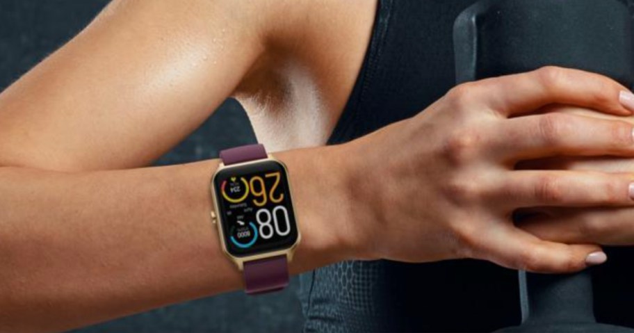 maroon smartwatch on wrist