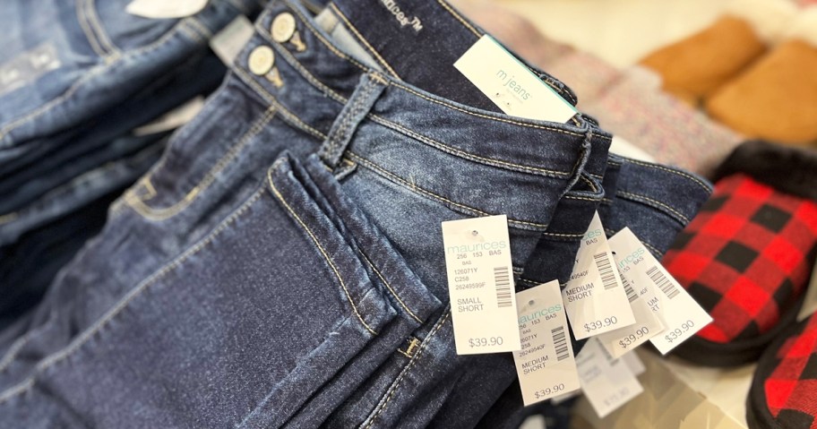 stack of maurices jeans in store