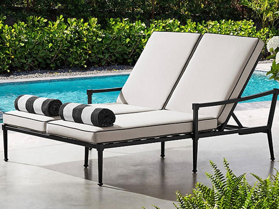 beige and black double chair lounger near pool 