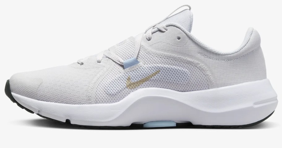 women's white and grey Nike workout shoe