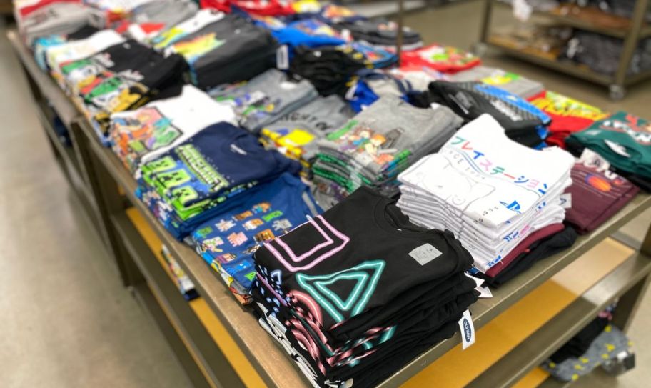 old navy boys tees folded and stacked on a store display table
