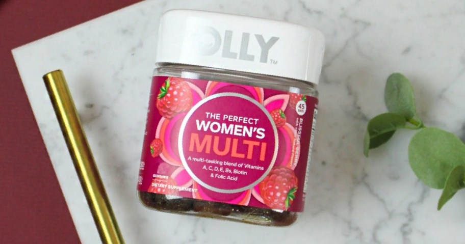 olly womens multivitamin bottle on table