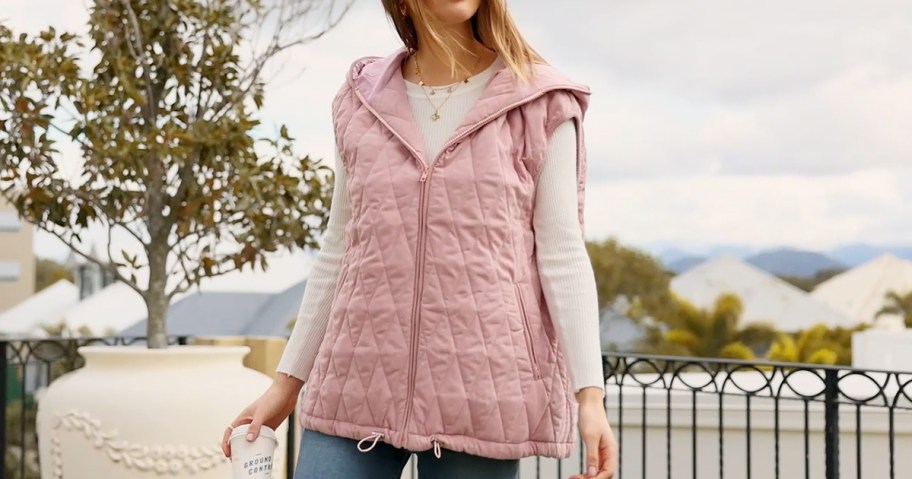 woman wearing pink vest 