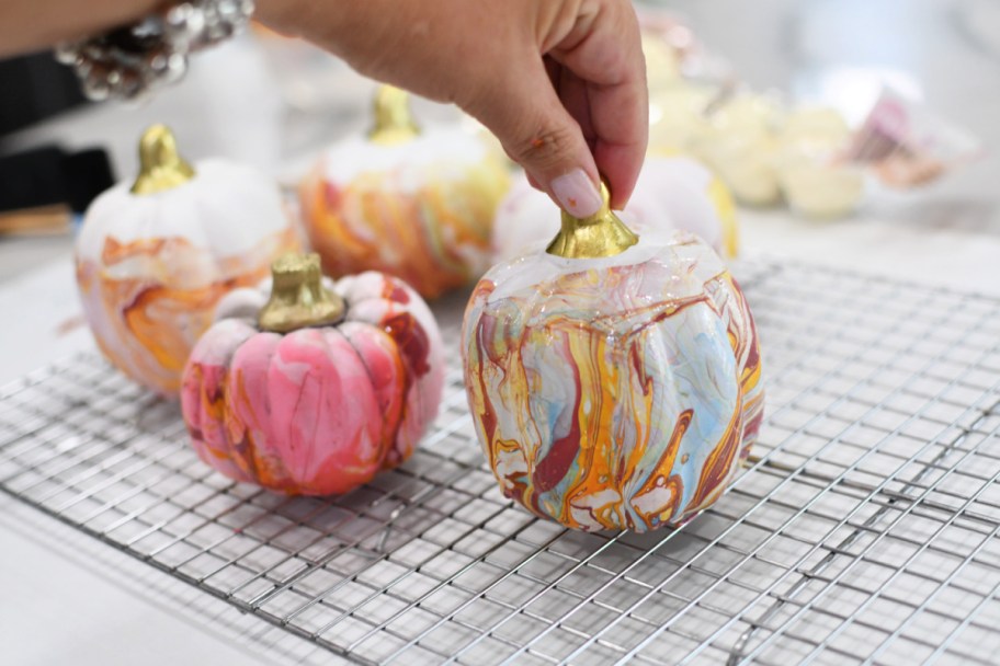 setting-painted-pumpkin-on-a-drying-rack