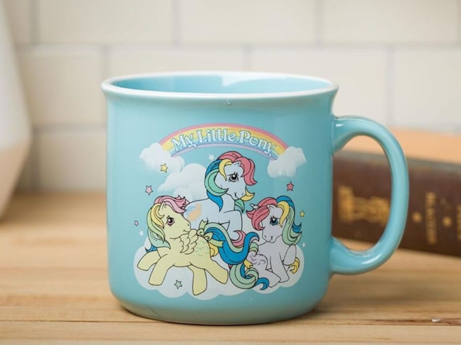 Silver Buffalo My Little Pony Ceramic Camper Mug 20oz on counter