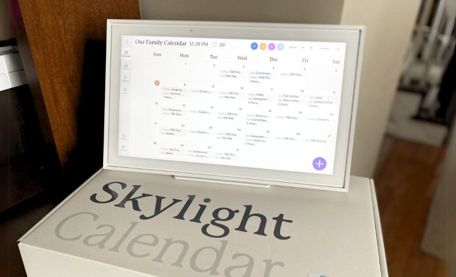 a skylight smart calendar on a desktop shown with box. 