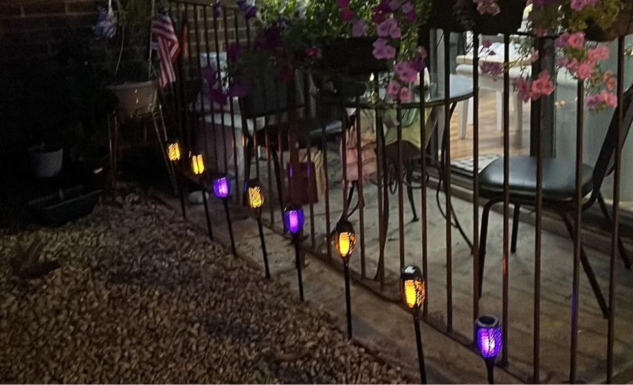 solar stake lights edging a patio