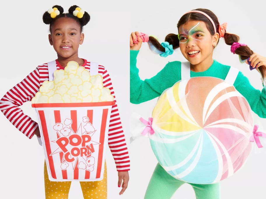 two girls wearing popcorn and lollipop costumes 