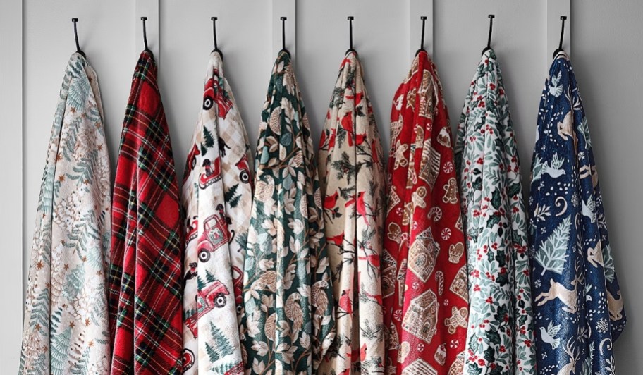 holiday throw blankets hanging on wall hooks