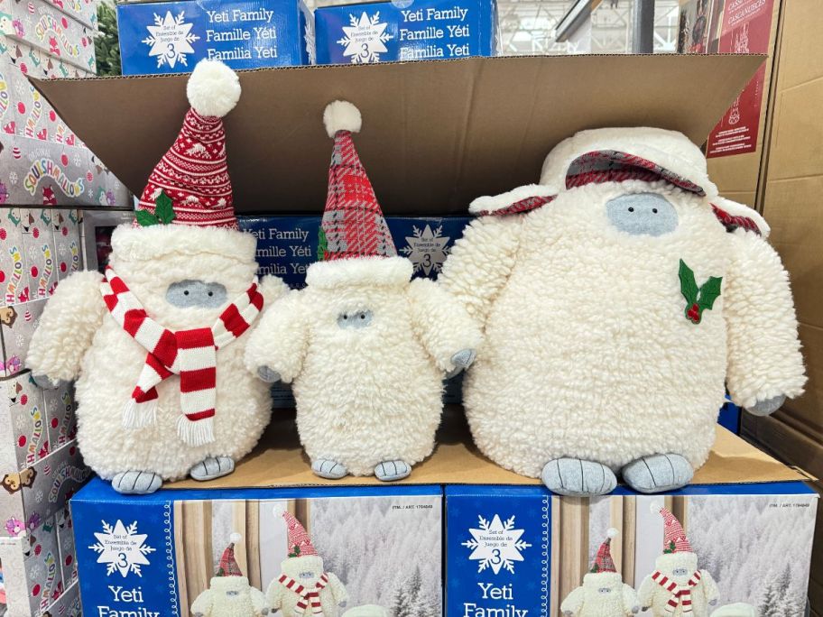 yeti plush family of 3 on display in a costco store