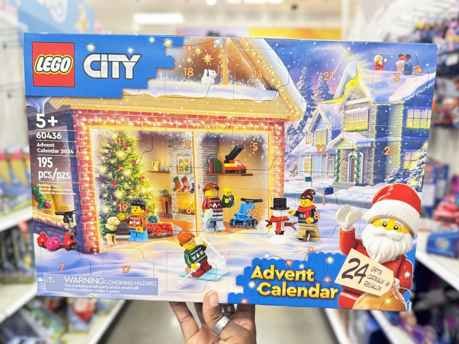 hand holding up LEGO City Advent Calendar in store