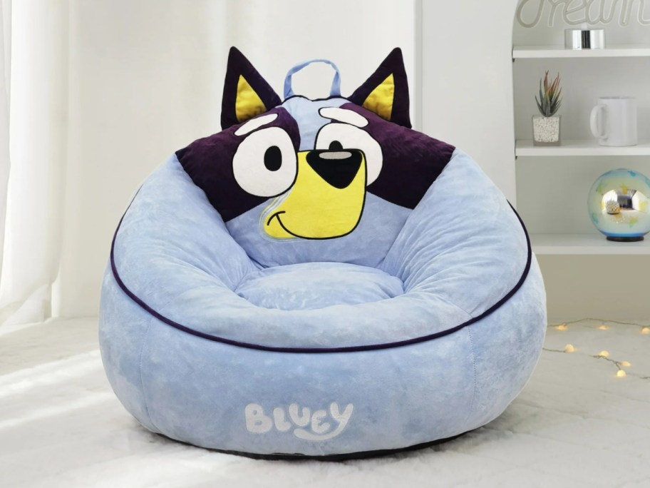 a Bluey kid's plush bean bag chair in a bedroom