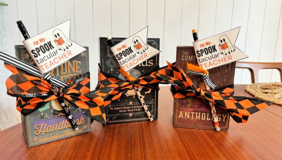 3 wrapped halloween book boxes with teacher tags