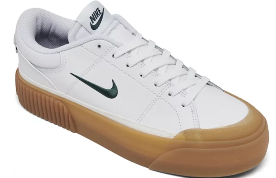 women's Nike court shoe in white with a tan rubber sole