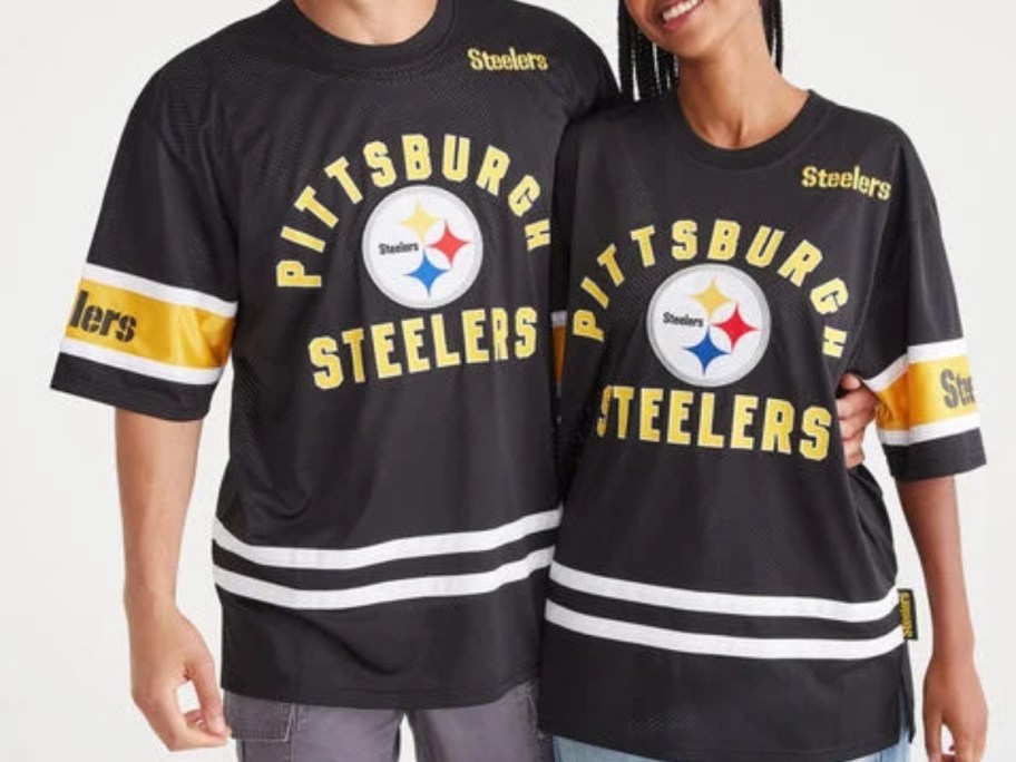 man and woman wearing a black and yellow Pittsburgh Steelers mesh jersey type top