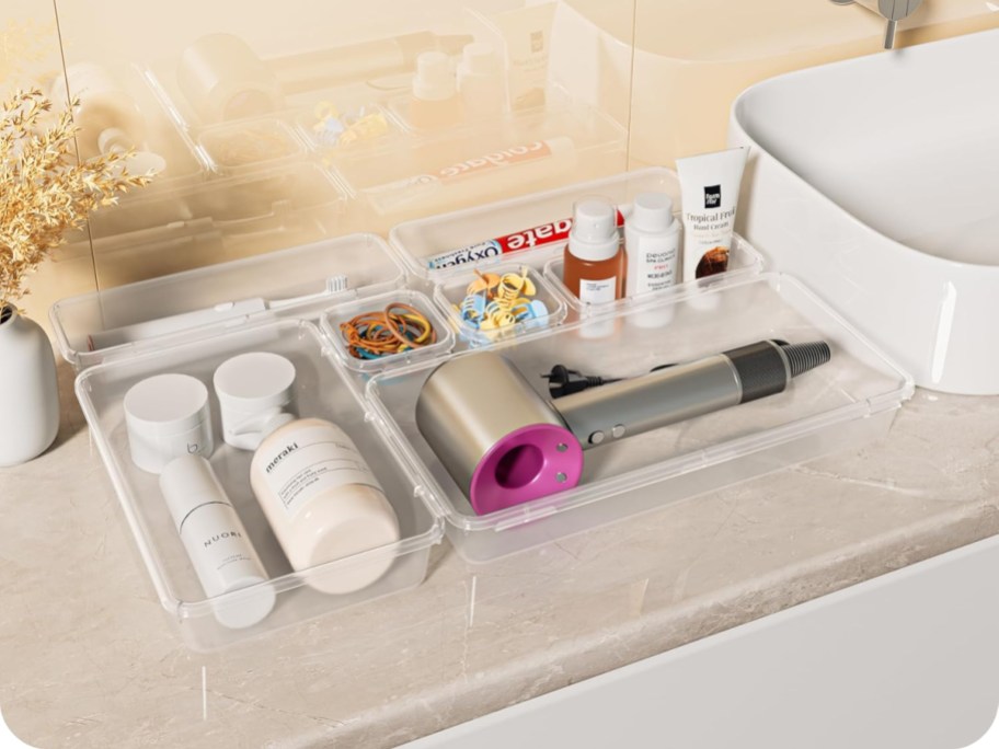 clear drawer organizers holding personal care items