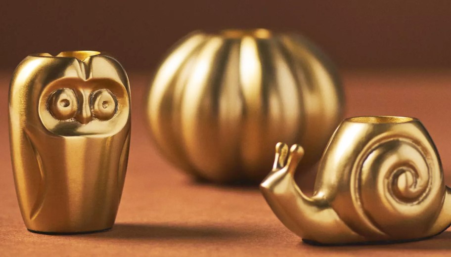 gold owl, snail, and pumpkin candle holders