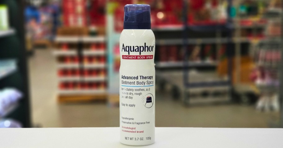 bottle of aquaphor healing ointment spray on table in store