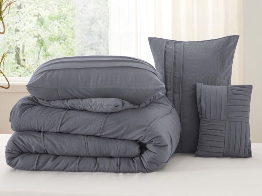 A gray comforter set in gray