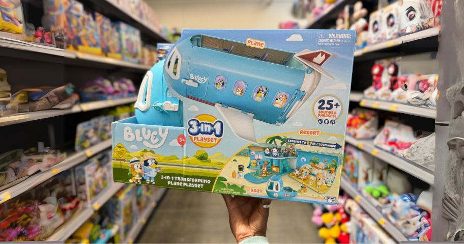 hand holding Bluey S11 3-in-1 Airplane Playset in store