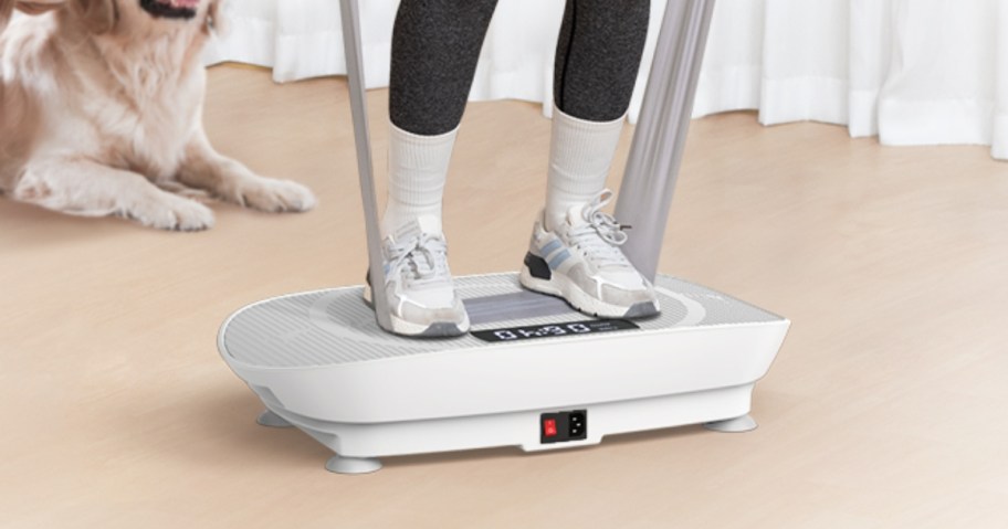 woman's feet on a white vibration plate exercise machine