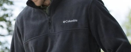 man wearing a navy blue Columbia fleece zip pullover