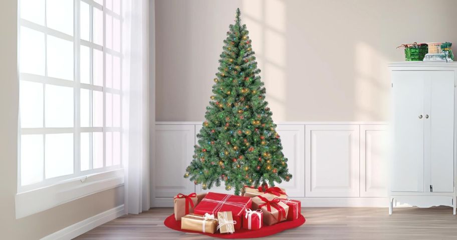 Holiday Time 6.5' Pre-Lit Madison Pine Artificial Christmas Tree in Green in living room