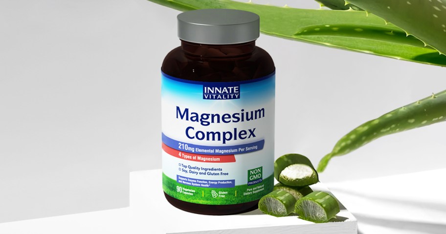 bottle of Innate Vitality Magnesium Complex near aloe vera plant