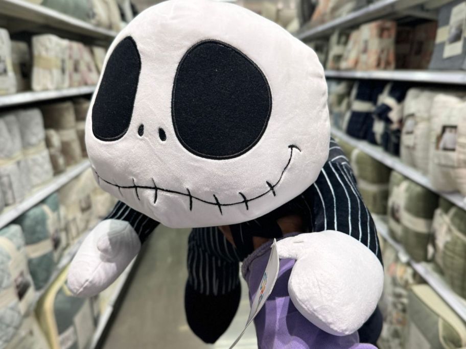 Hand holding up a Cuddleez Jack Skellington Plush