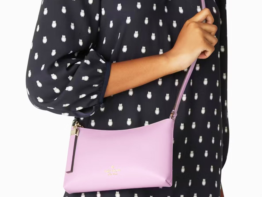 woman in owl print dress with purple crossbody bag