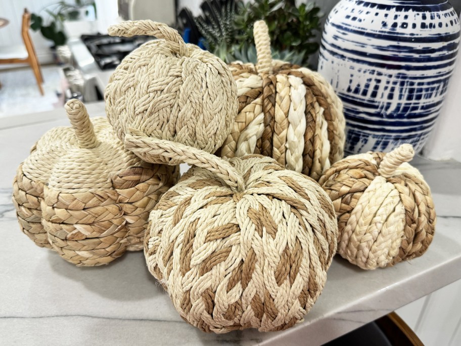 set of rattan pumpkins on counter