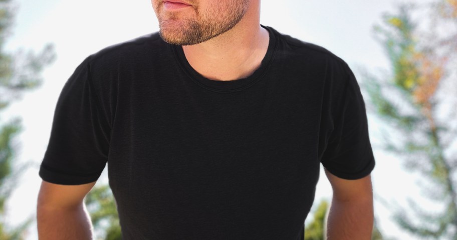 man wearing a black crewneck t-shirt