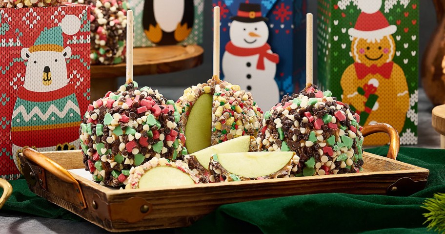 set of christmas caramel apples on a serving tray