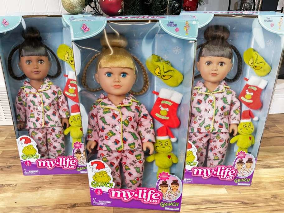 three My Life As Grinch Dolls in boxes on floor