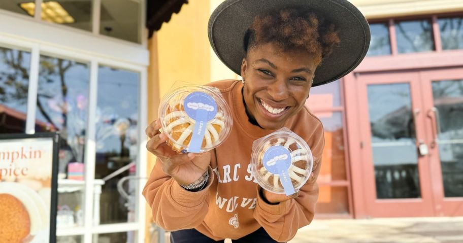 A person holding 2 Nothing Bundt Cakes 