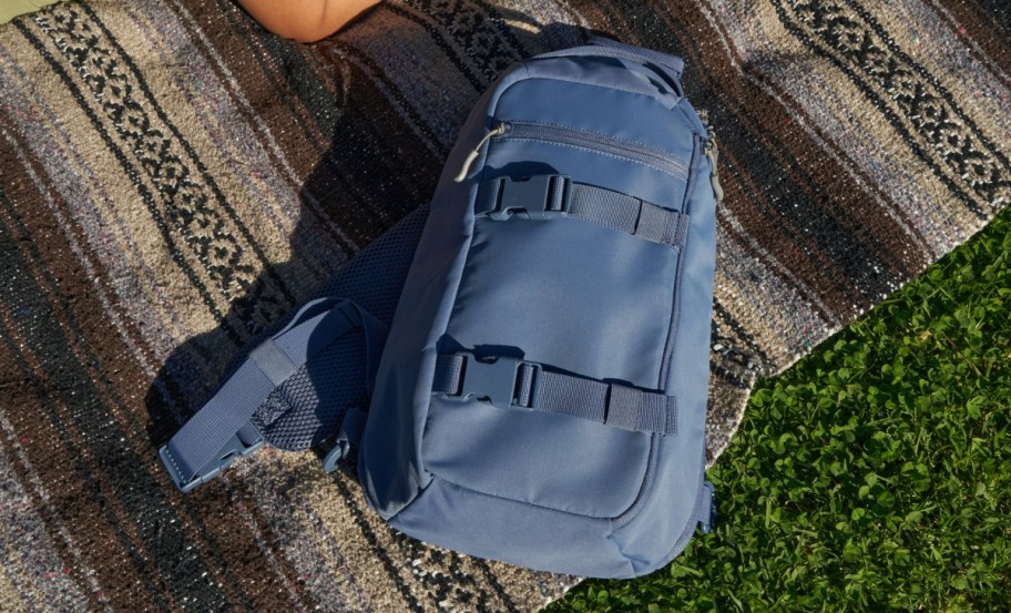 Ozark Trail Sling Pack on the floor in blue