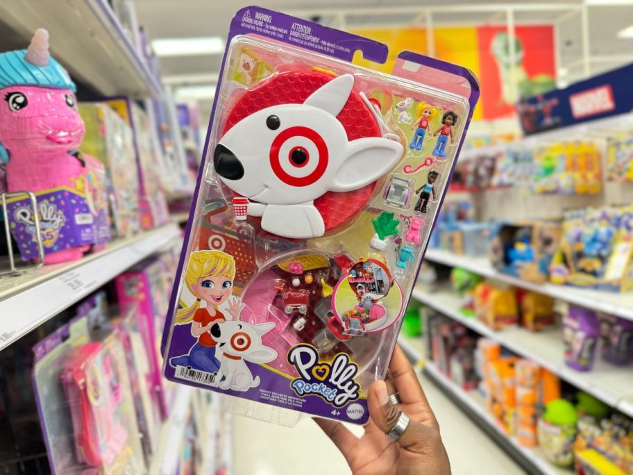 A person holding a Polly Pocket Target Bullseye Adventure Set