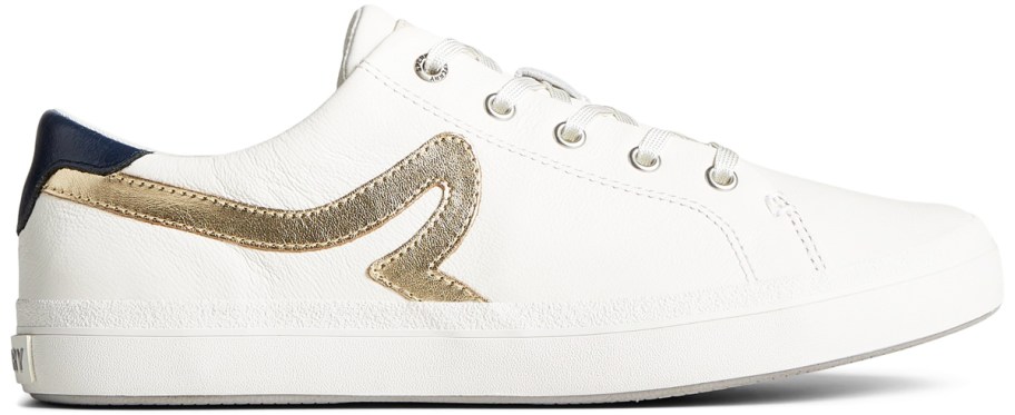 white sneaker with gold accents