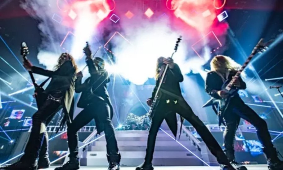 men playing guitars on stage with laser lights around them as part of the Trans-Siberian Orchestra show
