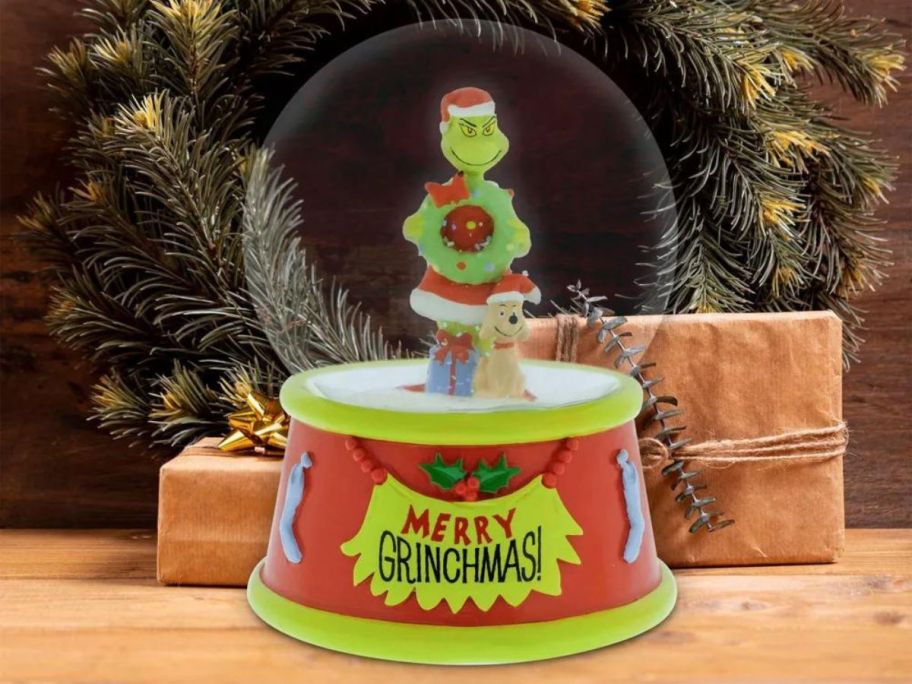 The Grinch 5.5" x 4" Christmas Snow Globe on table