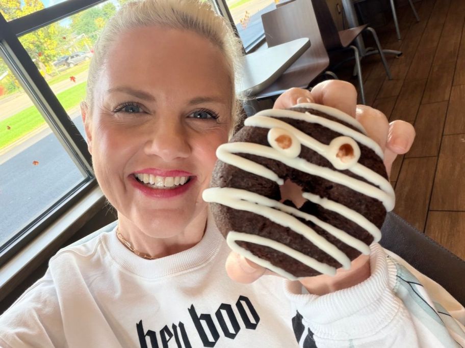 Woman holding a Tim Hortons Mummy Donut