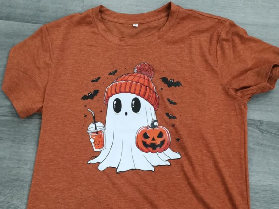 An orange t-shirt with a ghost on it