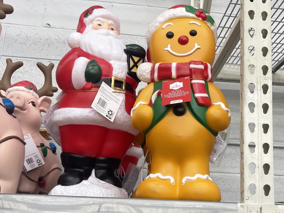 santa and gingerbread man blow molds on store shelf