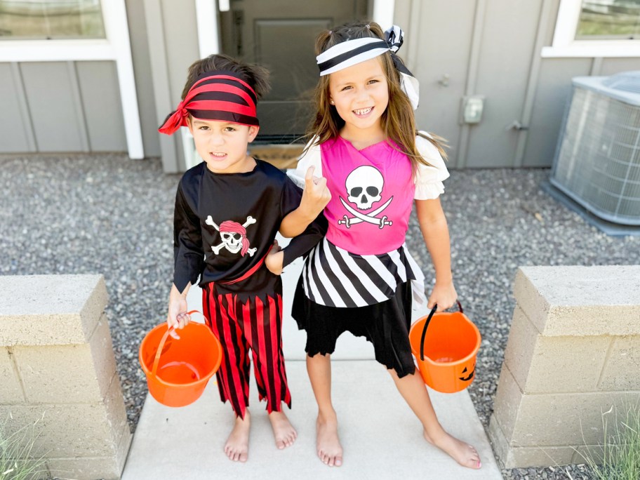 girl and boy in pirate halloween costumes