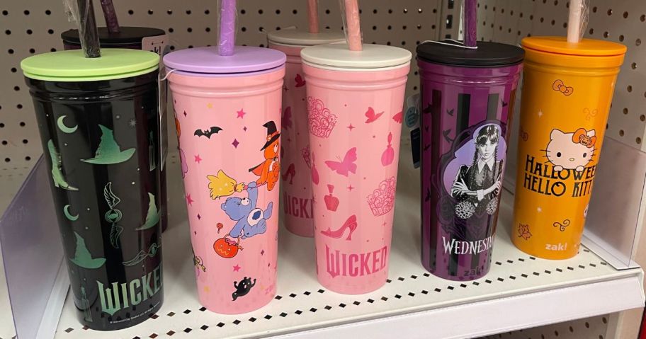 5 Zak Designs Halloween Tumblers on the shelf at Target featuring Wicked, Care Bears, Wednesday and Hello Kitty