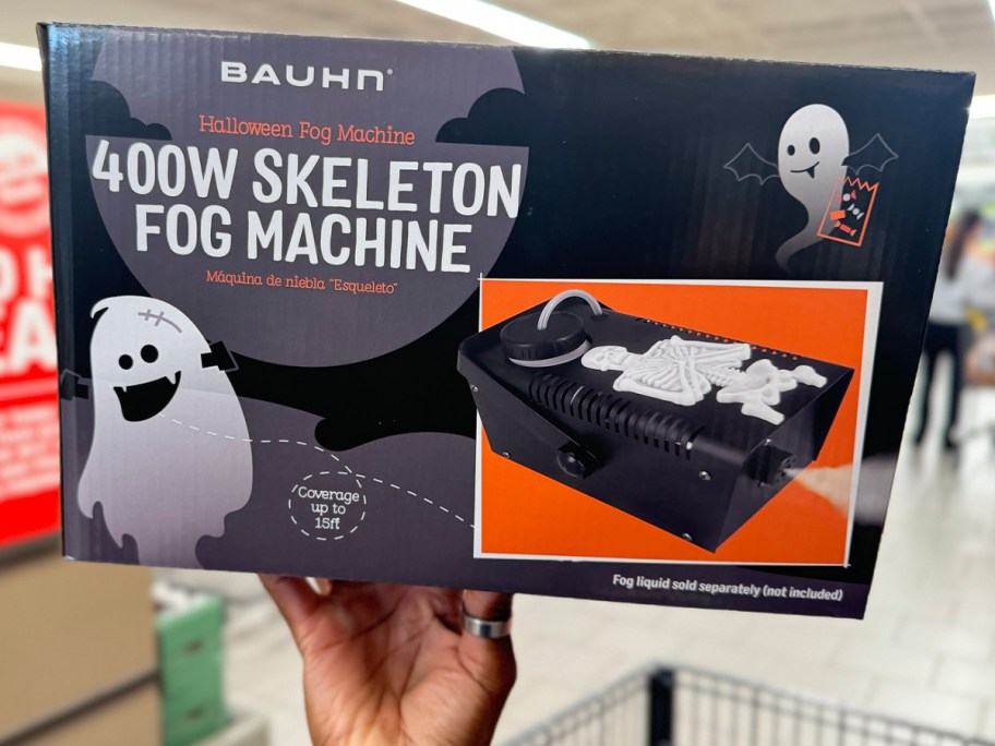 hand holding skeleton fog machine