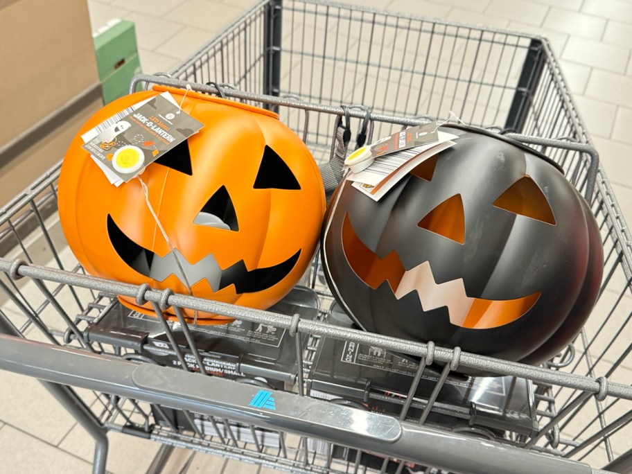 orange and black metal pumpkins in shopping cart 