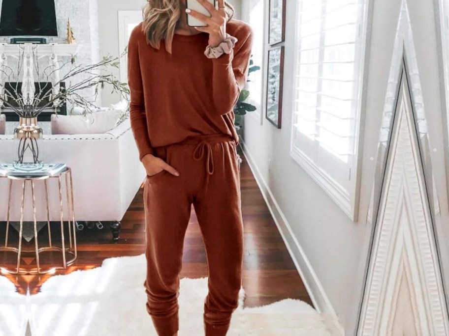 woman taking selfie in brown matching set